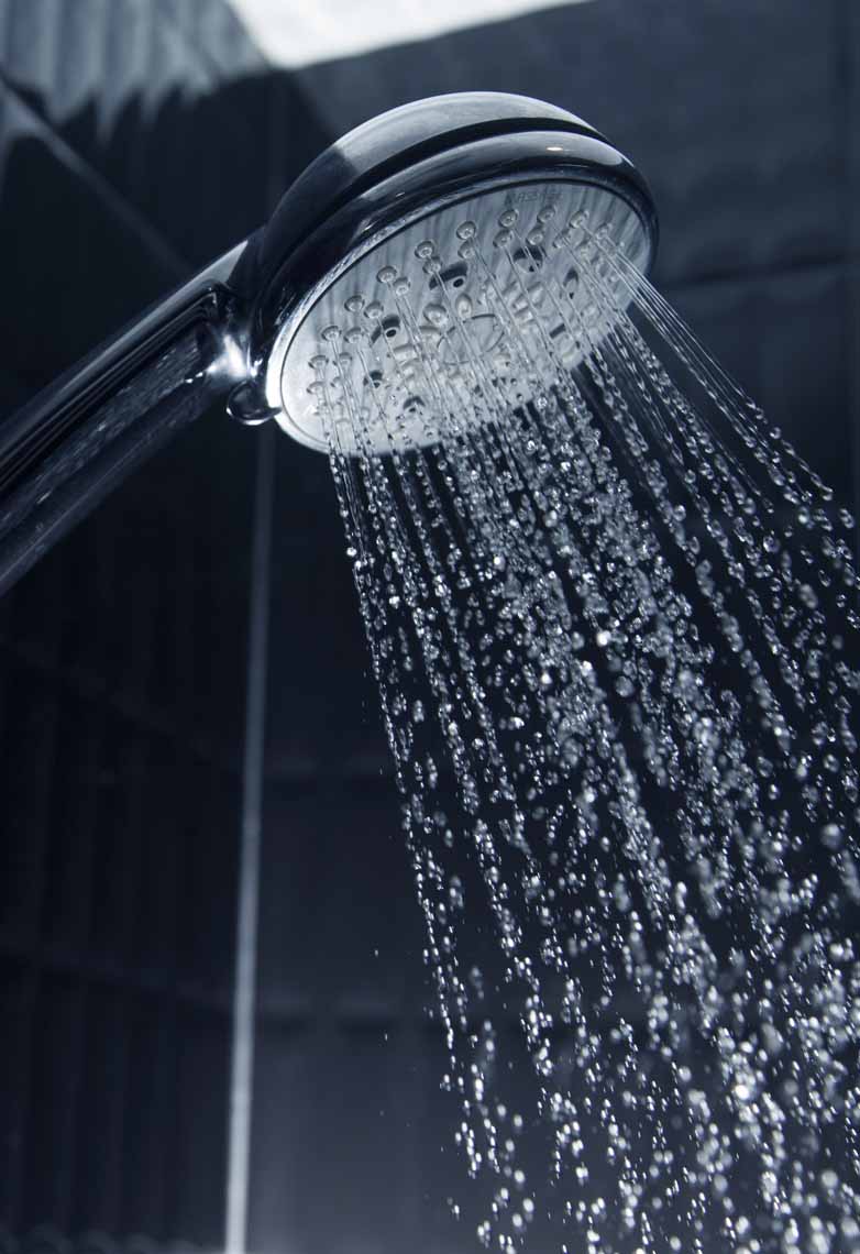 Sleek shower head with running water Sleek shower head with running water