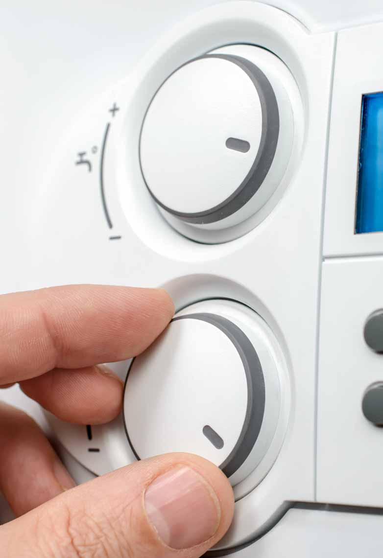 Person adjusting smart thermometer Person adjusting smart thermometer