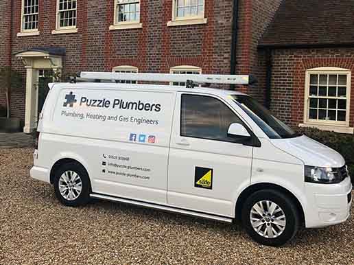 Side profile of a Puzzle Plumbers van Side profile of a Puzzle Plumbers van