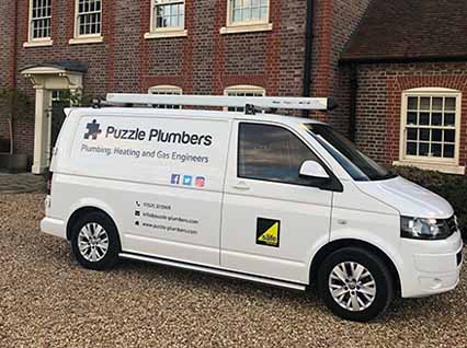Side profile of a Puzzle Plumbers van Side profile of a Puzzle Plumbers van